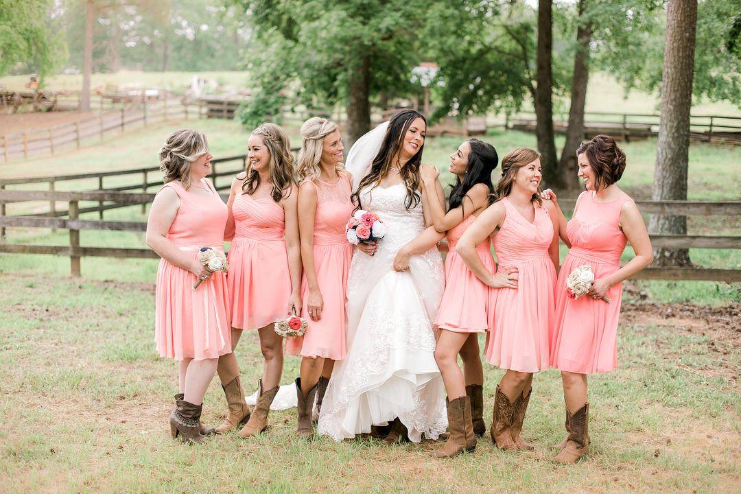 Bride and bridesmaids getting married in sanford north carolina at a horse farm and old west town