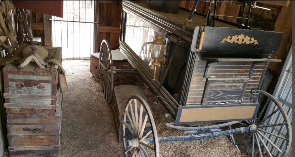horse drawn hearse at the undertaker's funeral home in the old west town